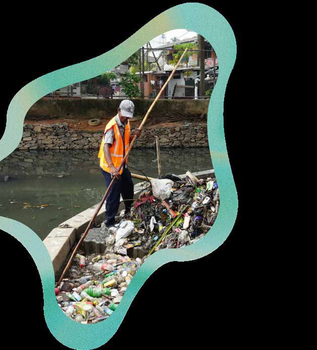 A river cleanup operation removing intercepted waste